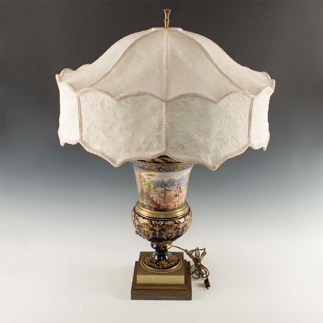 EARLY 19TH CENTURY ATTRIBUTED TO SEVRES PORCELAIN &: Extremely fine, hand painted. Exhibited in 1827 at Salon de Paris. An extremely fine Sevres porcelain vase with heavy bronze base and lid. Cobalt ground with detailed gold Rococo decorations. A pictur