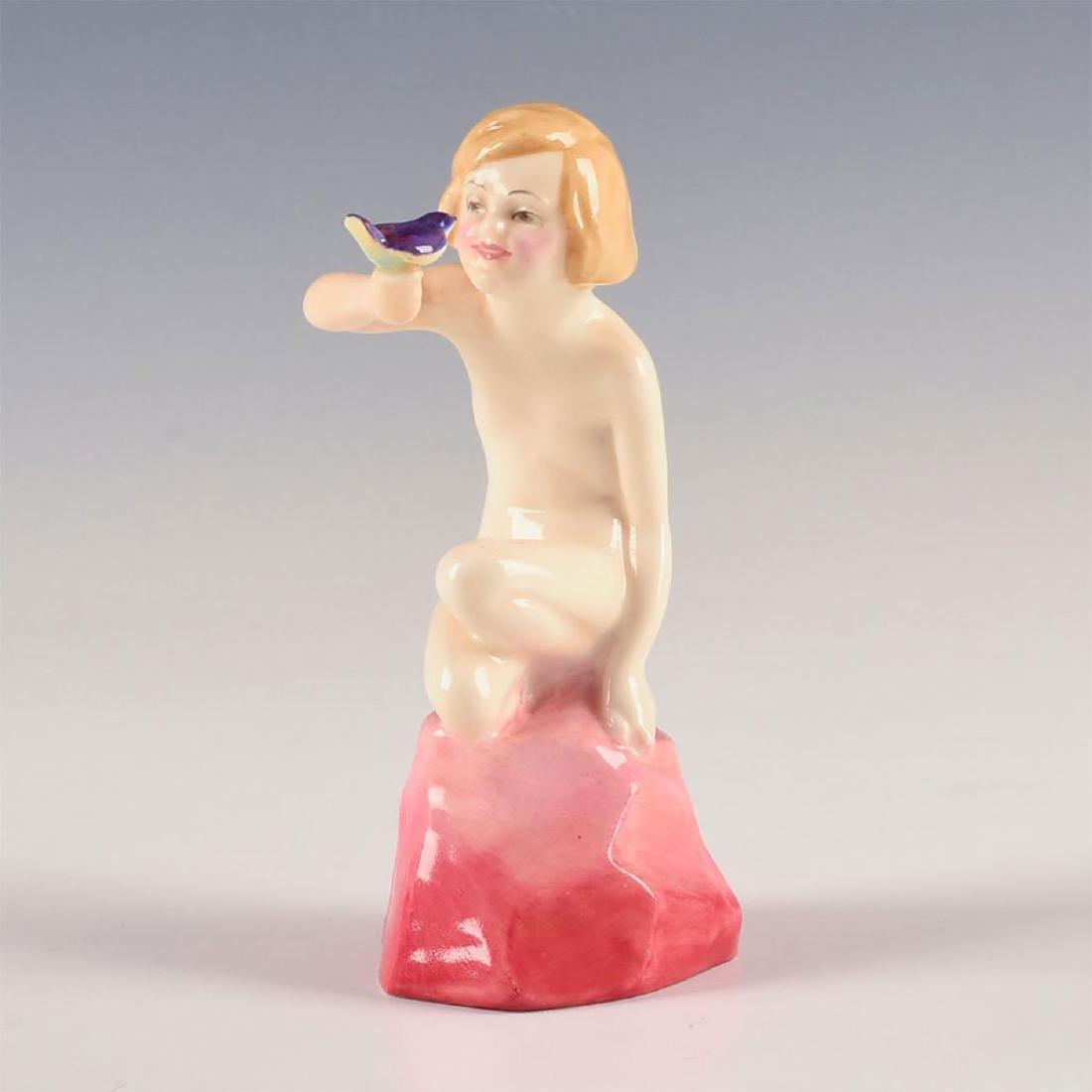 ROYAL DOULTON FIGURINE, BLUE BIRD HN 1280: A nude child holding a delicate bird. Pink, cream, yellow. A Leslie Harradine child study, in a delicate and lustrous cream, pink, and yellow colorway. The child kneels on a volcanic rock while balanc