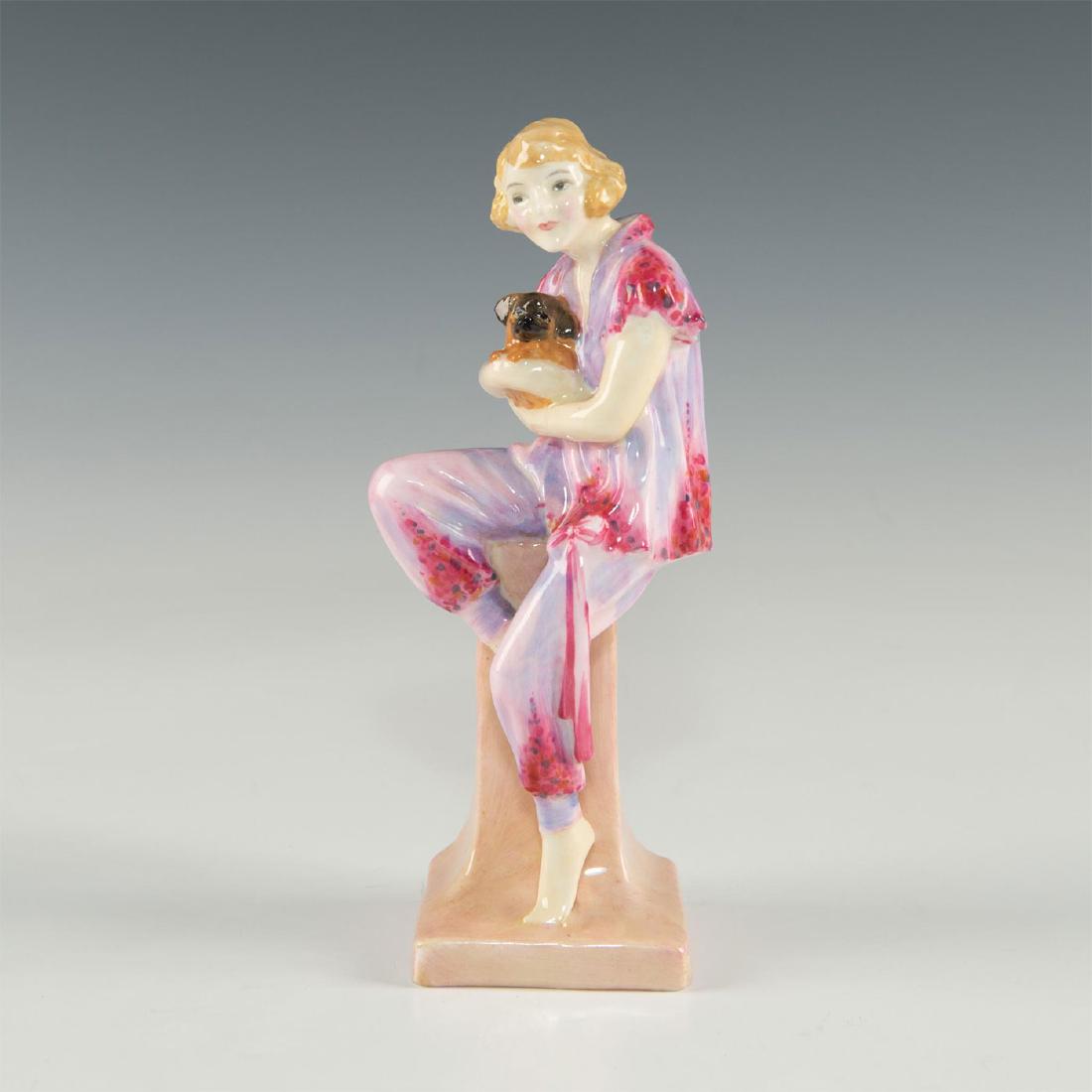 ROYAL DOULTON FIGURE LIDO LADY HN1220: Modeled in pink sitting on a pedestal, holding a small brown dog. First version original Royal Doulton Art Deco figure. The name Lido Lady may have been taken from a Noel Coward song satirizing the mo