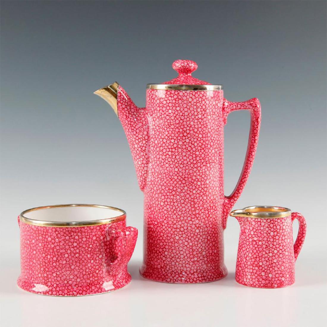 ROYAL DOULTON SHAGREEN 3 PC TEA SET WITH LID: Includes teapot with lid, creamer and double handle sugar bowl. Art Deco pink Shagreen pattern each with silver hallmarked rims and G.B. & Sons Ltd marked. Includes teapot with lid 7.25"H, creamer wit