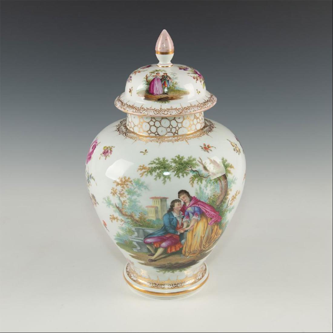 ADOLF HAMANN CHINOISERIE STYLE GILT GINGER JAR: Dresden made porcelain jar with large detailed scenes with figures. Chinese inspired footed ginger jar shape decorated in the style of Meissen and Sevres. Ice white glazed overall body and lid. Top c