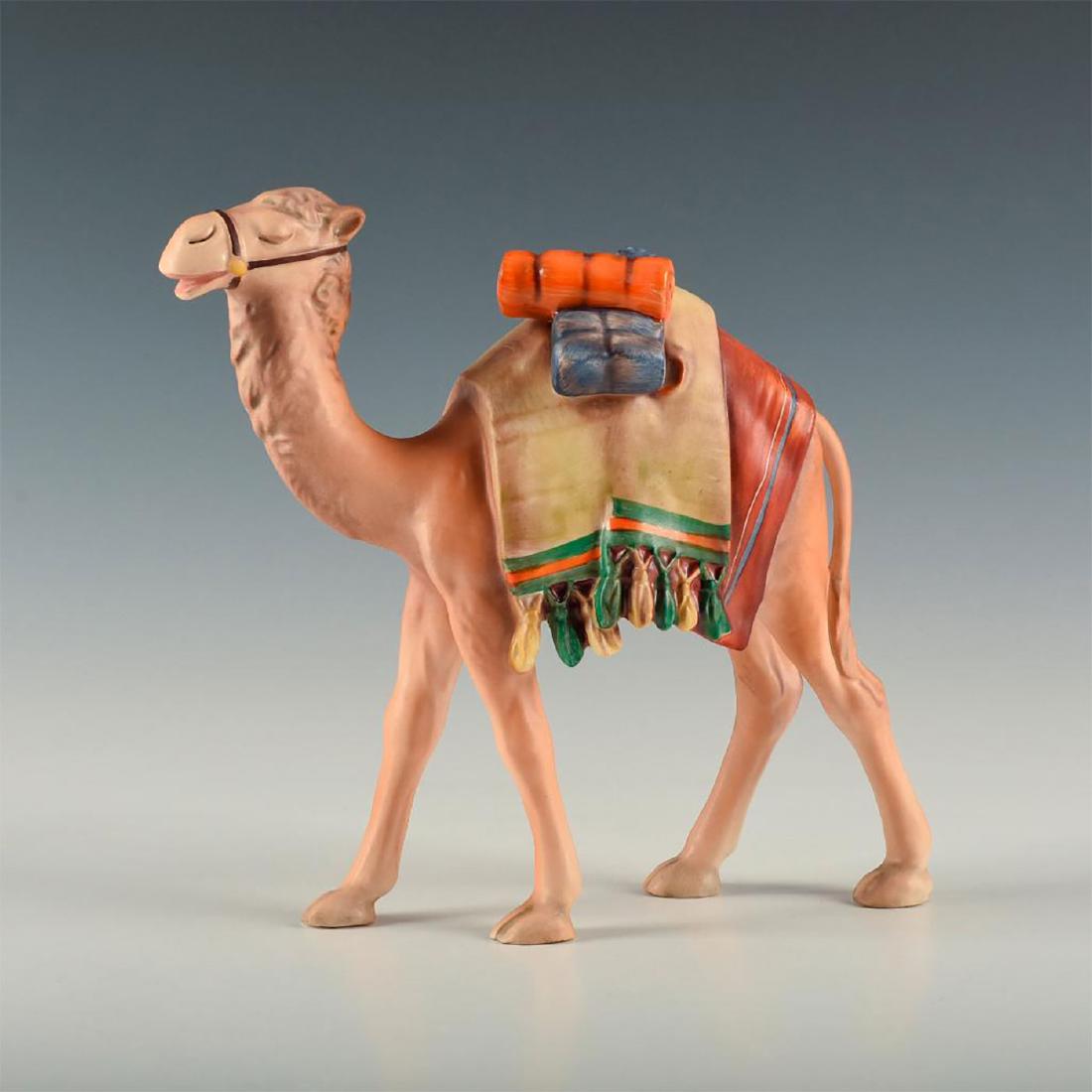 HUMMEL FIGURE, CAMEL: Large figure of a standing camel with colorful, decorated gear . Back of right leg incised with model number X306, dated 1960. W. Goebel backstamp. Artist: Unknown Issued: 1960 Dimensions: 8"H Manufa