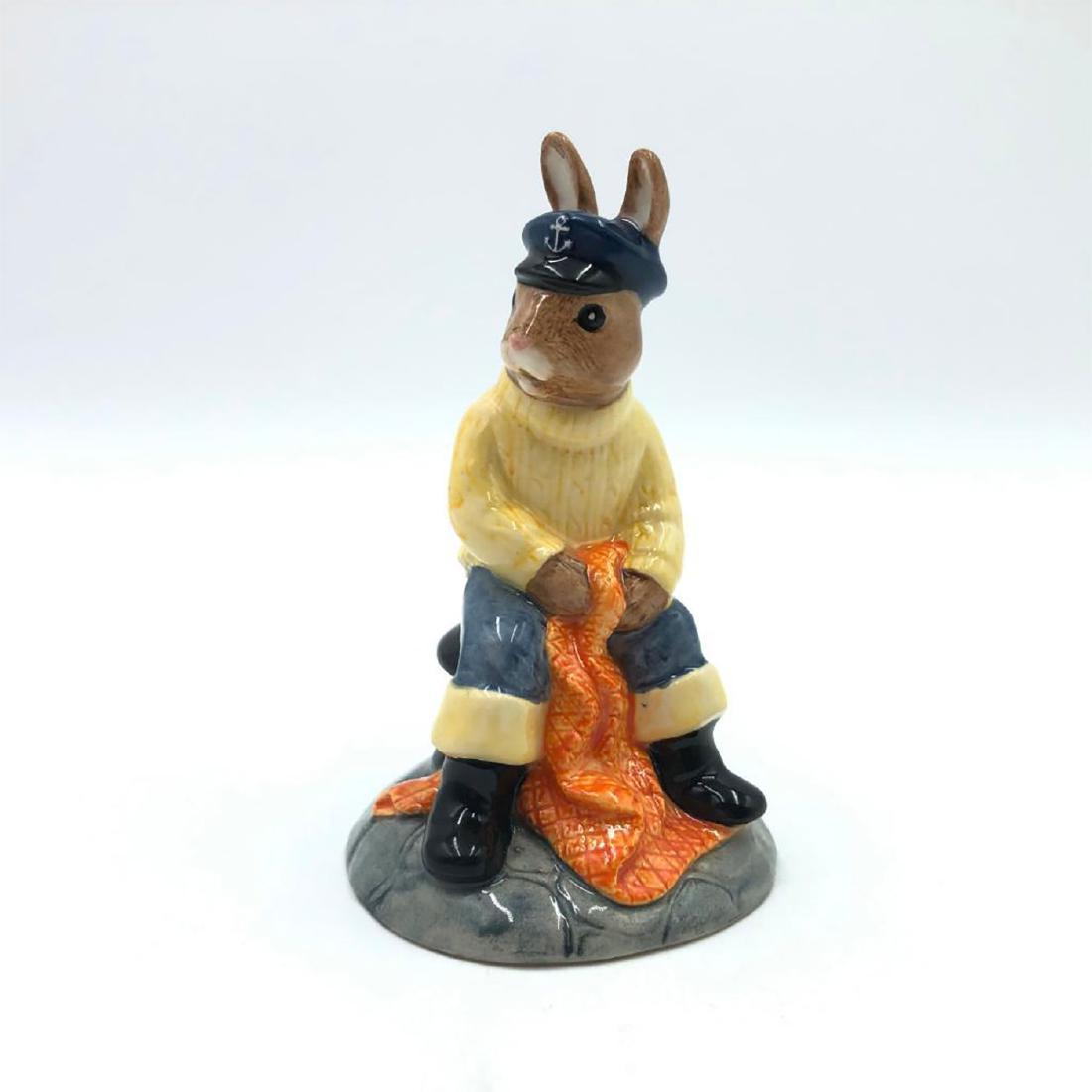 ROYAL DOULTON FISHERMAN BUNNYKINS DB170: Bunny dressed as a fisherman Captain. Hand painted blue hat and trousers, light yellow sweater and black wellingtons. Artist: Graham Tongue and Shane Ridge Issued: 1997-2000 Dimensions: 4"H Manufactur