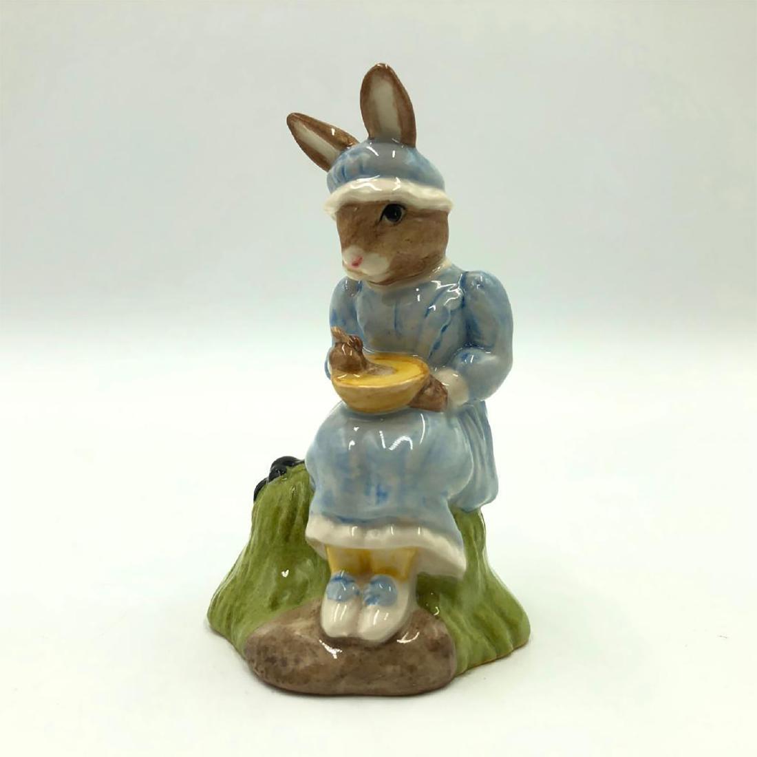 ROYAL DOULTON LITTLE MISS MUFFET BUNNYKINS DB240: Bunny sitting on her tuffet, eating curds, along came a spider. From Nursery Rhyme Collection. Hand painted pale blue and white dress. Artist: Caroline Dadd and Warren Platt Issued: 2002-2004 Dimensio