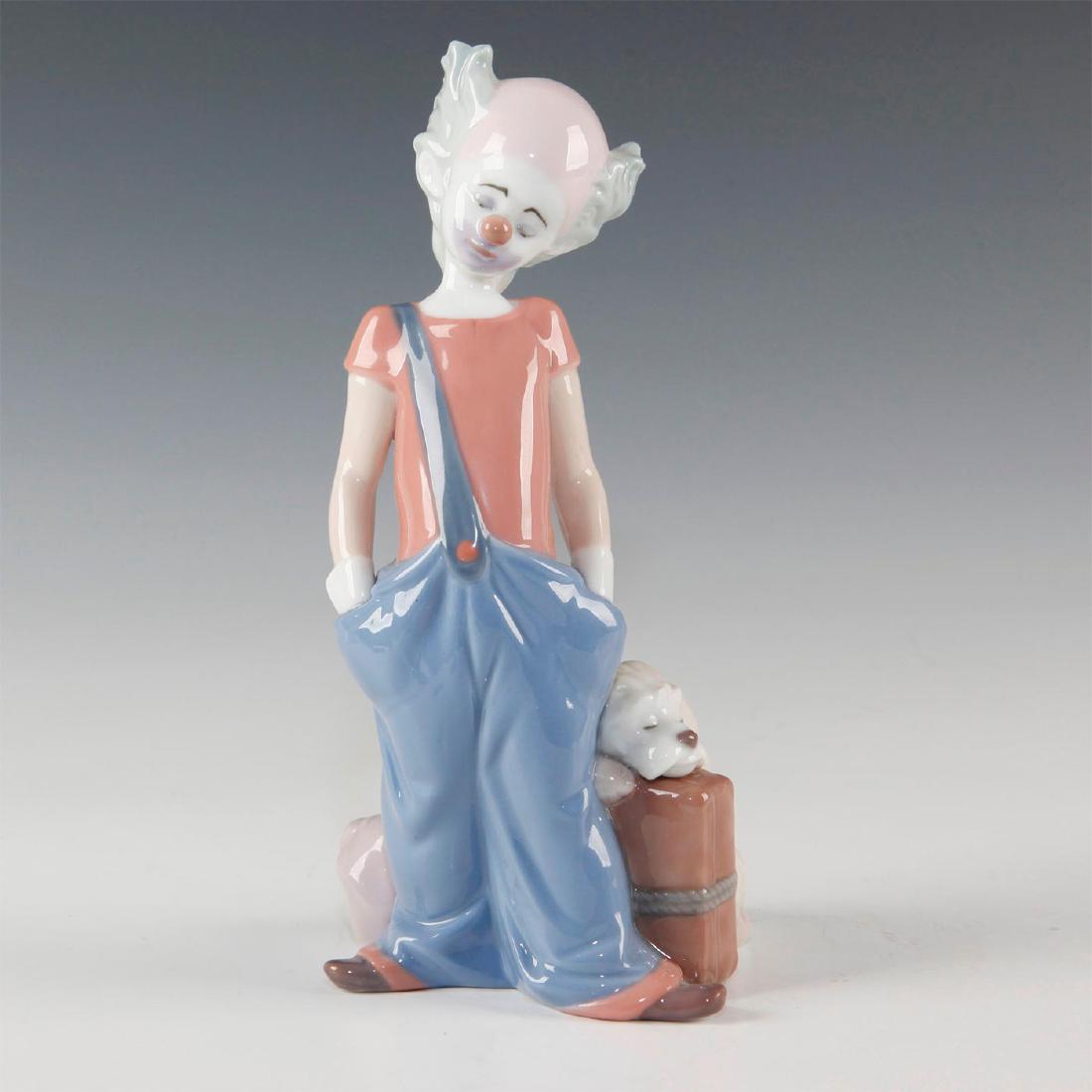 LLADRO FIGURINE DESTINATION BIG TOP: Sad clown with dog sleeping on the suitcase - Lladro number 01006245. El Payasito Melancolico (with box). Artist: Juan Huerta Issued: 1996 Dimensions: 5.4"H Manufacturer: Lladro Country of Origin: Spa