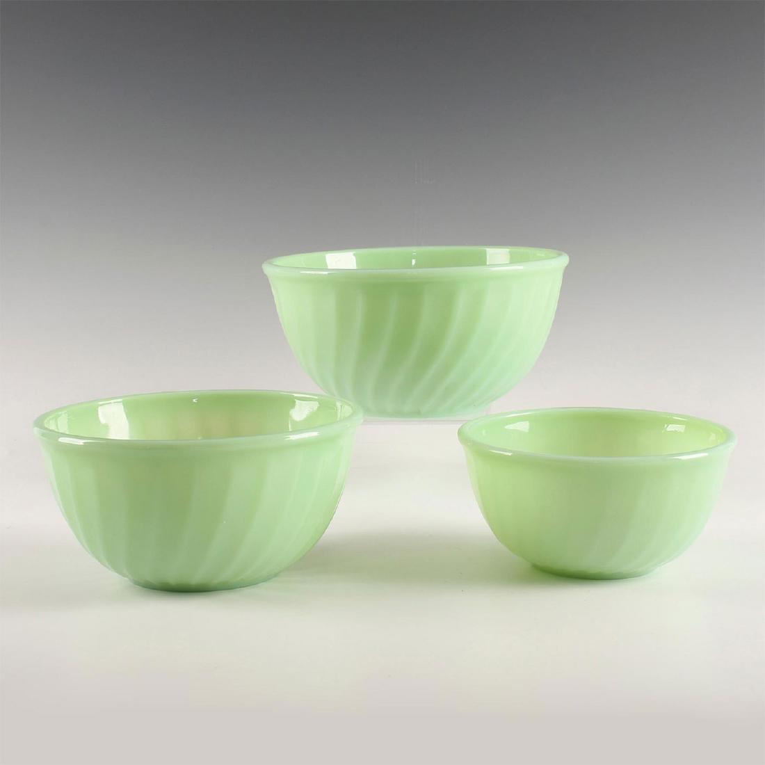 LOT OF 3 MID CENTURY MODERN FIRE-KING BAKING BOWLS: Lime green series of 3 nesting sizes, with subtly fluted exteriors. Vintage US make, oven safe. Dimensions: 8"D X 4"H, largest 6"D X 2.75"H, smallest Manufacturer: Fire King Country of Origin: United 