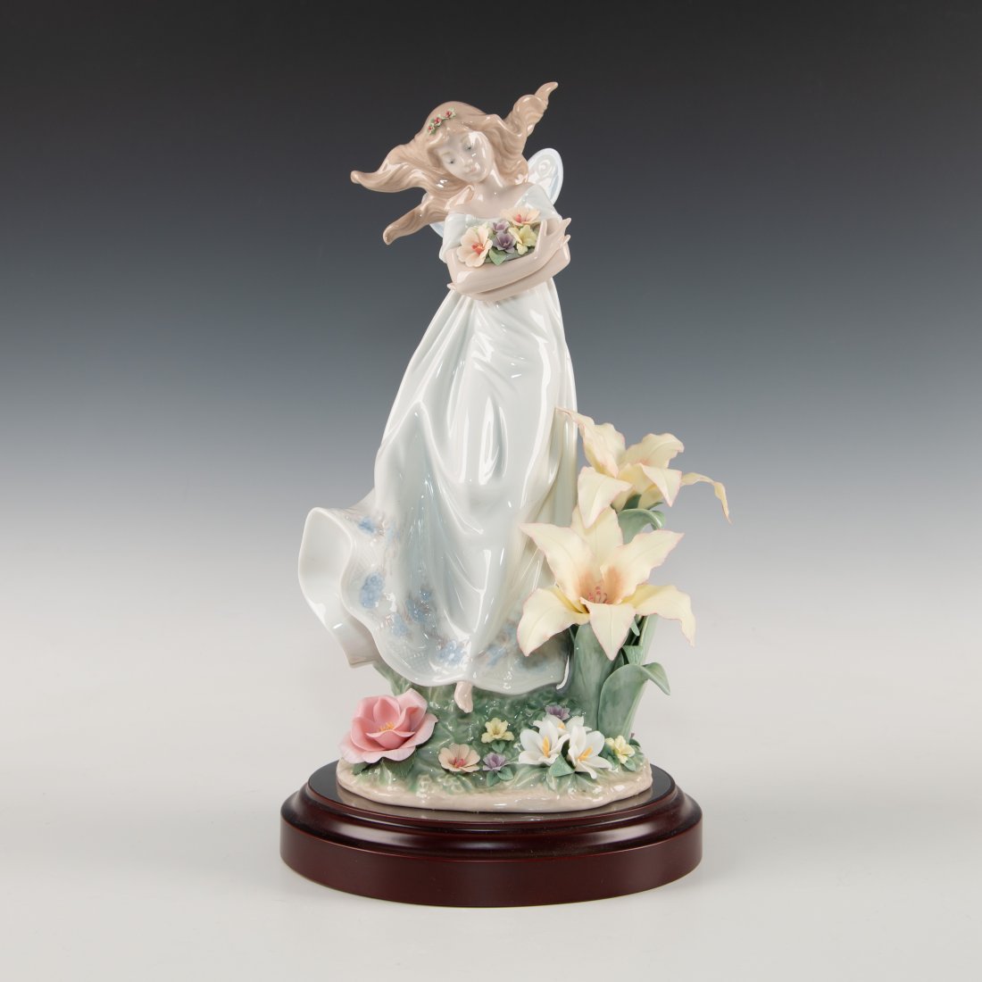 LLADRO FIGURINE MYSTICAL GARDEN: Mystical girl surrounded by colorful flowers - Lladro number 01006686. JARDIN DE LAS HADAS (with box/base). Artist: Jose Javier Malavia Issued: 2000 Dimensions: 6.75"H Manufacturer: Lladro Country of 