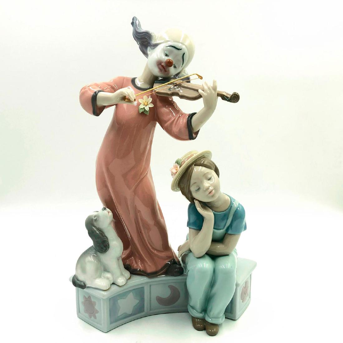 LLADRO FIGURINE MUSIC FOR A DREAM: Clown playing a violin for a lady and a dog - Lladro number 01006900. MUSICA PARA UN SUENO (with box). Artist: Marco Antonio Nogueron Issued: 2002 Dimensions: 9.2"H Manufacturer: Lladro Country of Ori