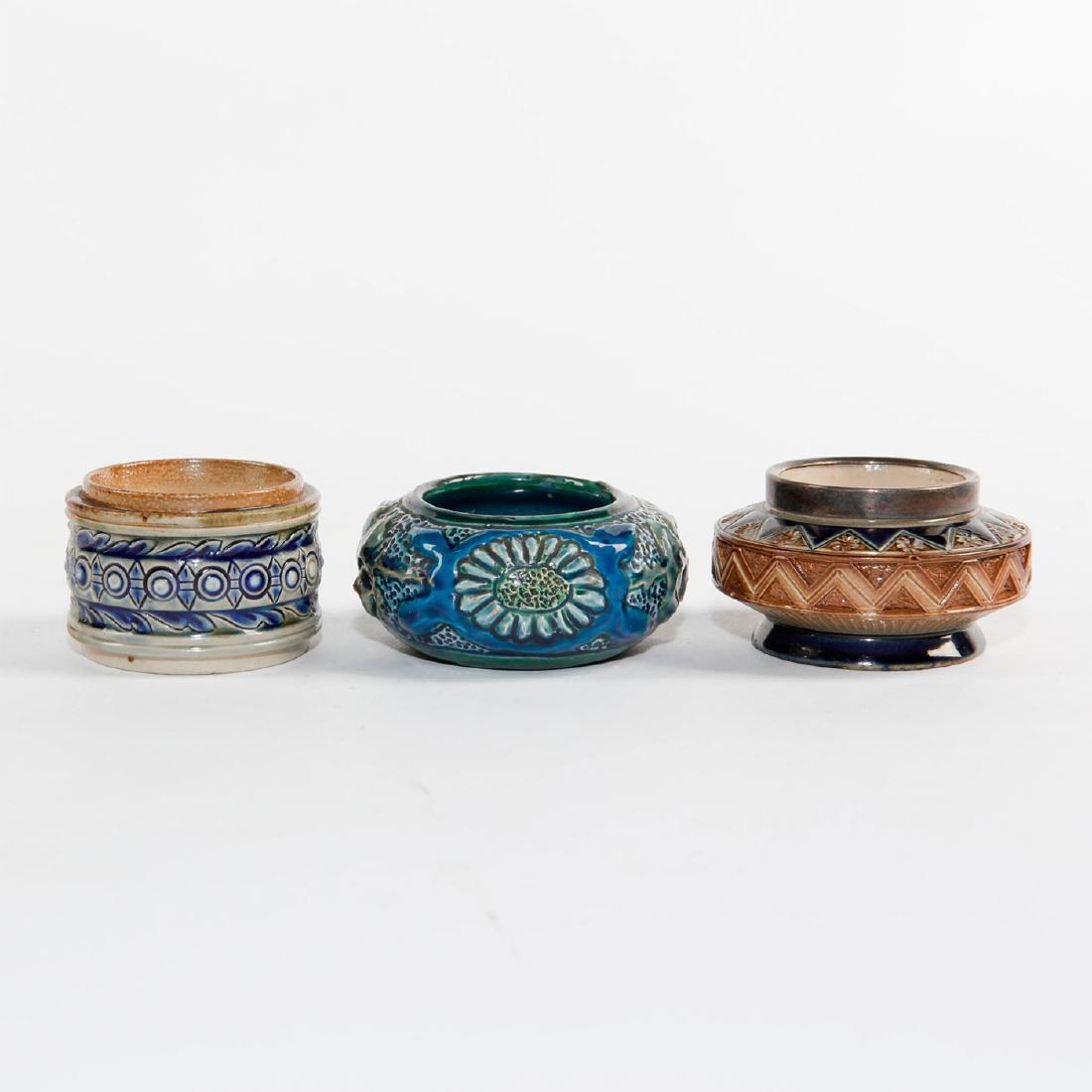 PAIR OF ANTIQUE STONEWARE OPEN SALTS, 1 NAPKIN RING: Royal Doulton salt w. hallmarked rim, rare Brannam salt, ring. The Brannam Barum is dated 1898 and is splendidly decorated in in high relief, with scribed and stippled decor in a rich blue and green g