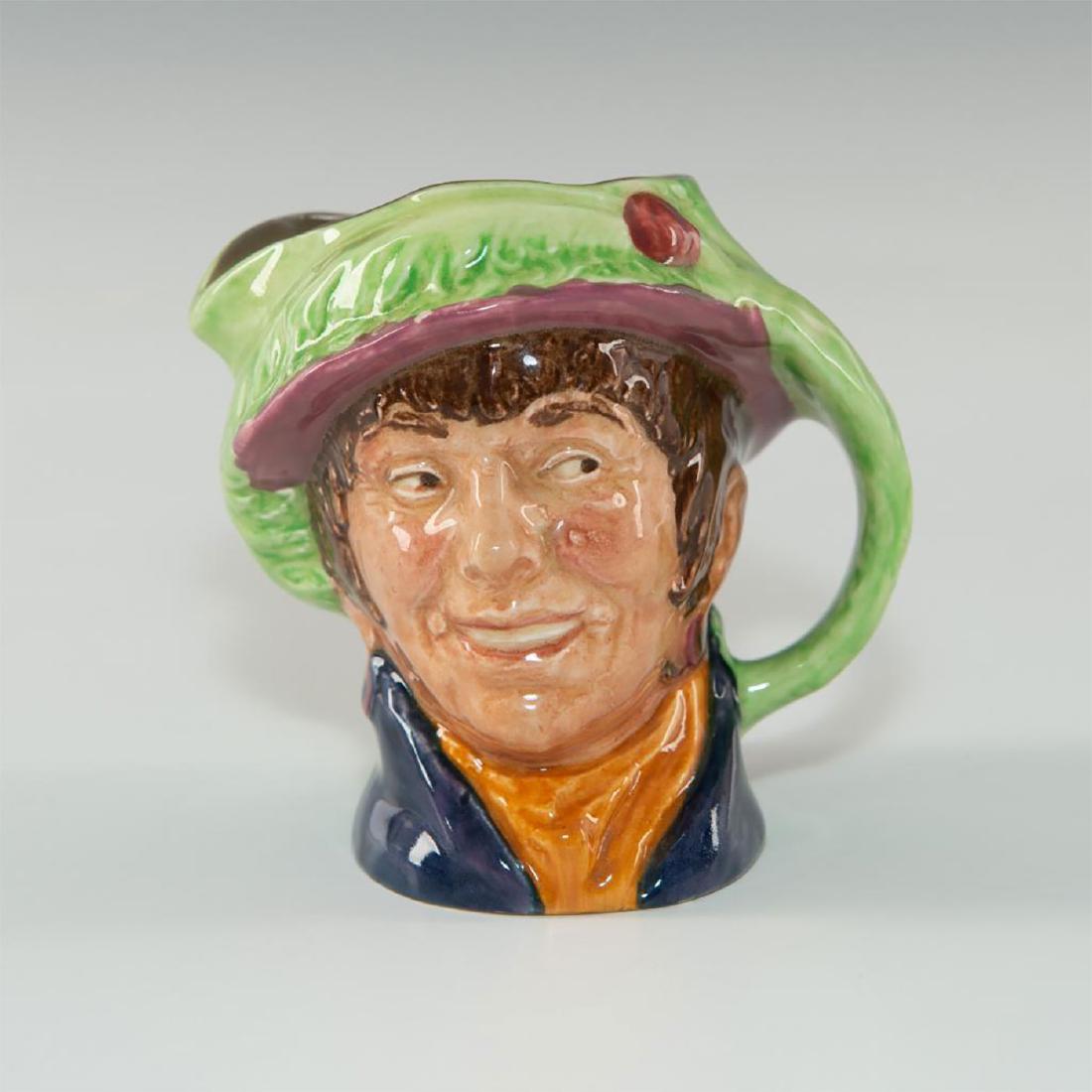 ROYAL DOULTON CHARACTER JUG SMALL PEARLY GIRL D6236: Green, brown, and yellow costermonger. Artist: Harry Fenton Issued: 1947-1960 Dimensions: 3.25"H Edition Number: D6236 Manufacturer: ROYAL DOULTON Country of Origin: England