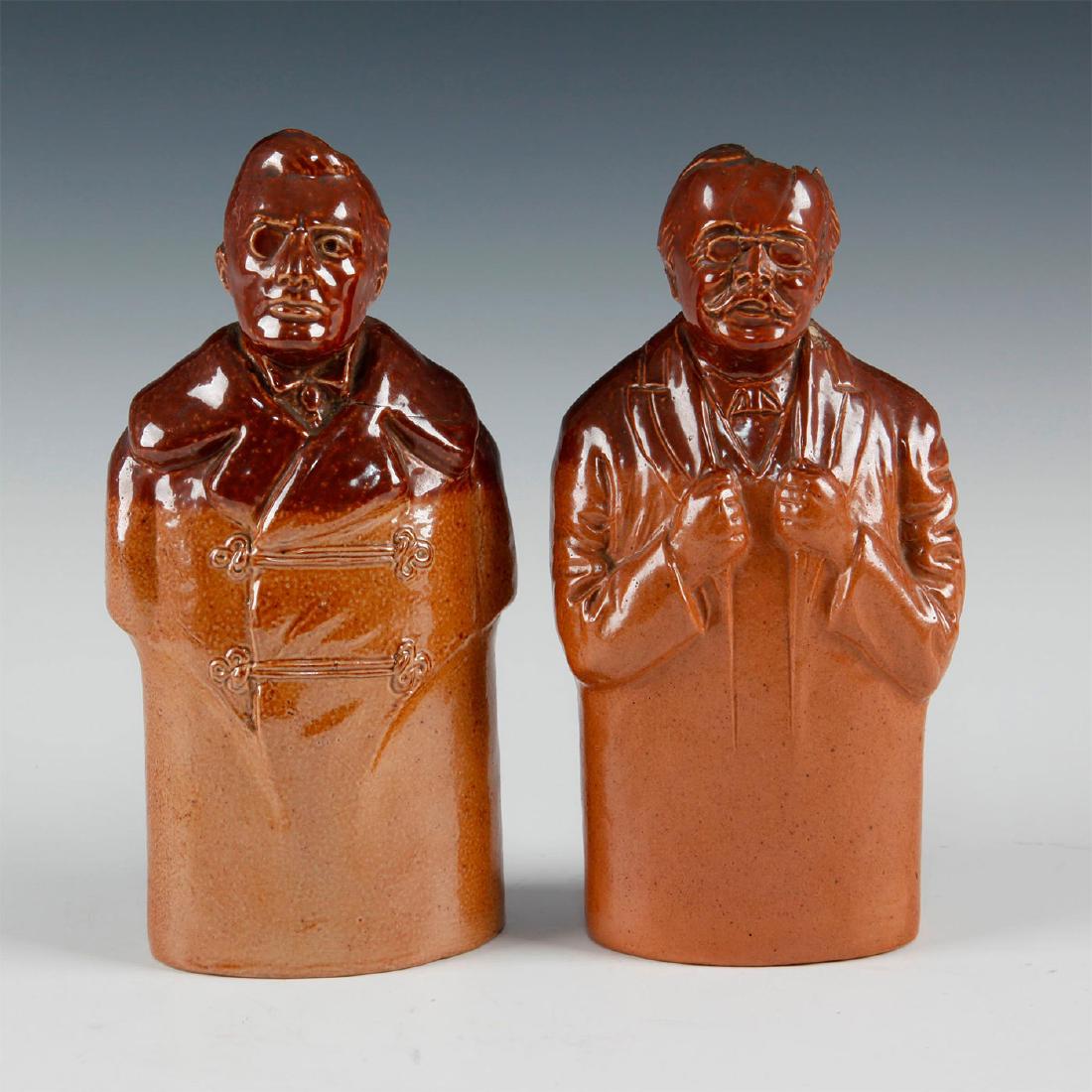 PAIR OF DOULTON LAMBETH STONEWARE 1910 SPIRIT FLASKS: Figures of Arthur Balfour and Austen Chamberlain. Some damage to the head of the Balfour flask. Issued: 1910 Dimensions: 7.75"H-tallest Manufacturer: Doulton Lambeth Country of Origin: England