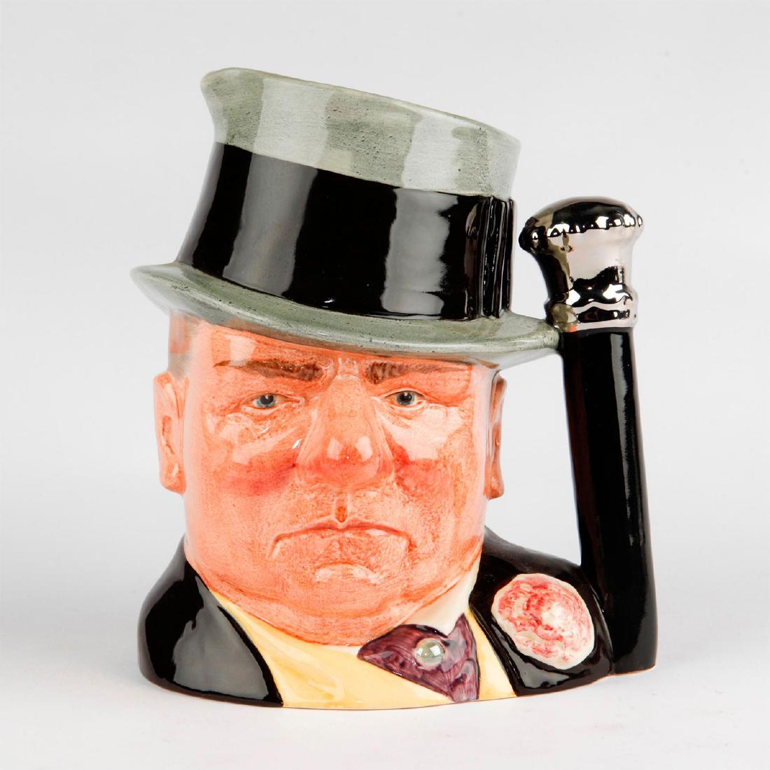 ROYAL DOULTON LARGE CHARACTER JUG, W.C. FIELDS: Premiere Edition piece from Doulton's Celebrity Collection. Piece has black, grey , yellow and purple coloration. Character depicts William Claude Dukenfield, an entertainer. Stamped on base is a quot