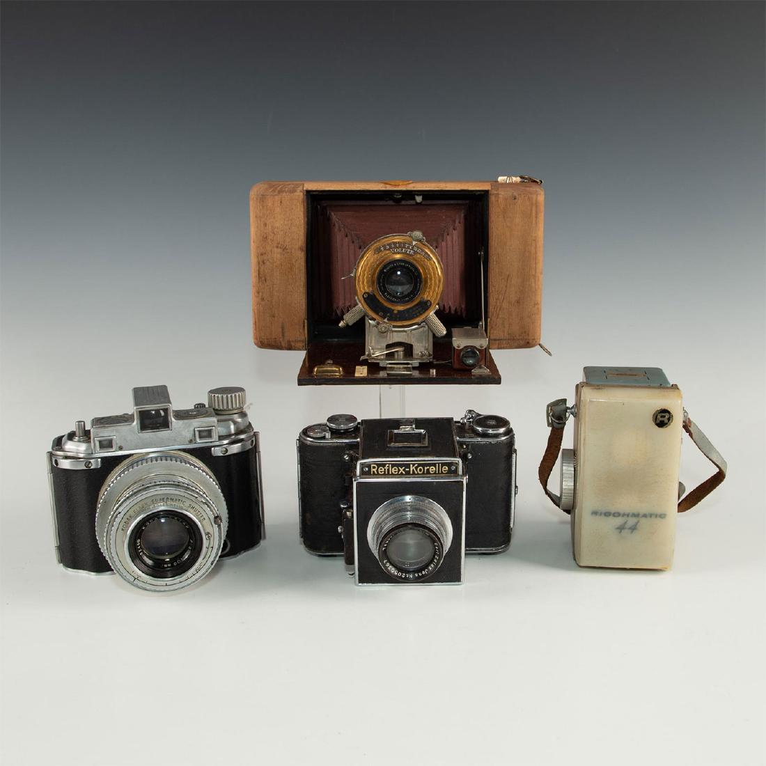 GROUP OF 4 ECLECTICALLY STYLED VINTAGE FILM CAMERAS: Unusual styles and designs- roll film folders, powder blue TLR. Ricohmatic 44 a Japanese 4X4 TLR made by Riken in 1959-60, during the brief 4X4 camera boom. One is reflex Korelle one of the earliest 6