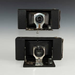 PAIR OF ANTIQUE HORIZONTAL FOLDING FILM CAMERAS: Larger, medium format cameras meant to take full-frame images. No.3A Folding Buster Brown with Deltax Wollensak shutter; No.3A Folding Buster Brown with Actus shutter. Cosmetically in good shape with