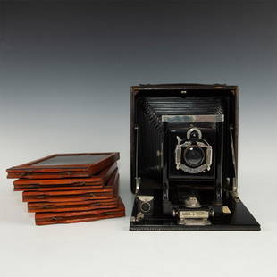 LARGE FORMAT SENECA 8 5X7 SHEET FOLDING CAMERA: Five 5 x 7 double sided sheet holders with folding camera. Issued: Early 20th c. Dimensions: 9"H x 12"L x 8.75"D Manufacturer: Seneca Country of Origin: United States