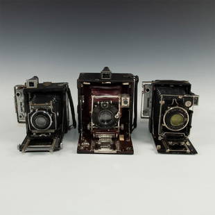 LOT OF 3 LARGE HIGHLY ORNAMENTED ANTIQUE PRESS CAMERAS: Wood, leather and chrome- Zeiss Ikon, Pony Premo, Speed Graphic. Issued: Early 20th c. Dimensions: 9.5"L x 7.5"D x 8"H, largest, open Country of Origin: Various