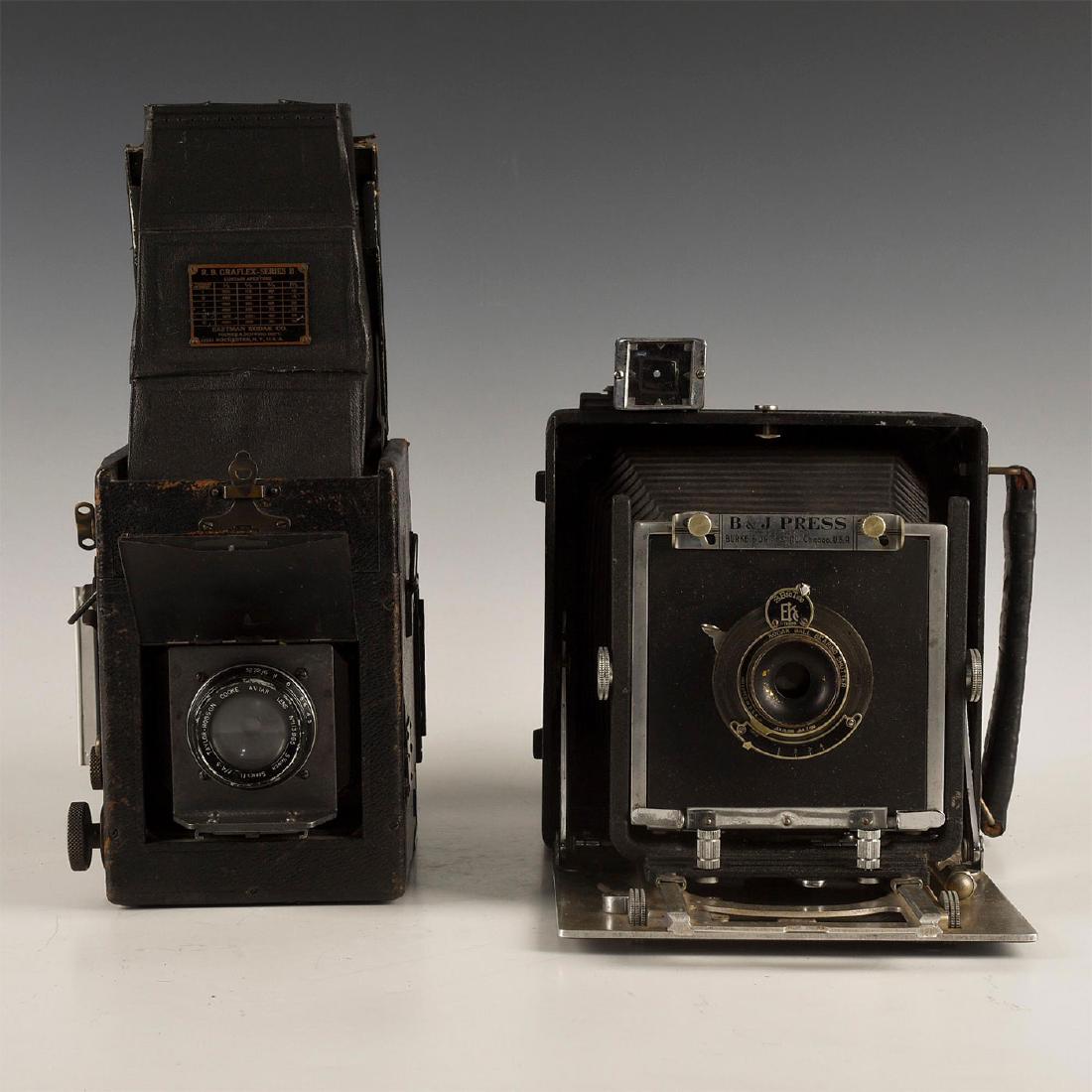 GROUP OF 2 VINTAGE PRESS CAMERAS GRAFLEX, BURKE & JAMES: Pair of iconic antique press camera styles. 1. Graflex Series B with built-in Kodak Anastigmat lens, with semi-automatic diaphragm, and the distinctive tall focusing hood that folds under the lid of t