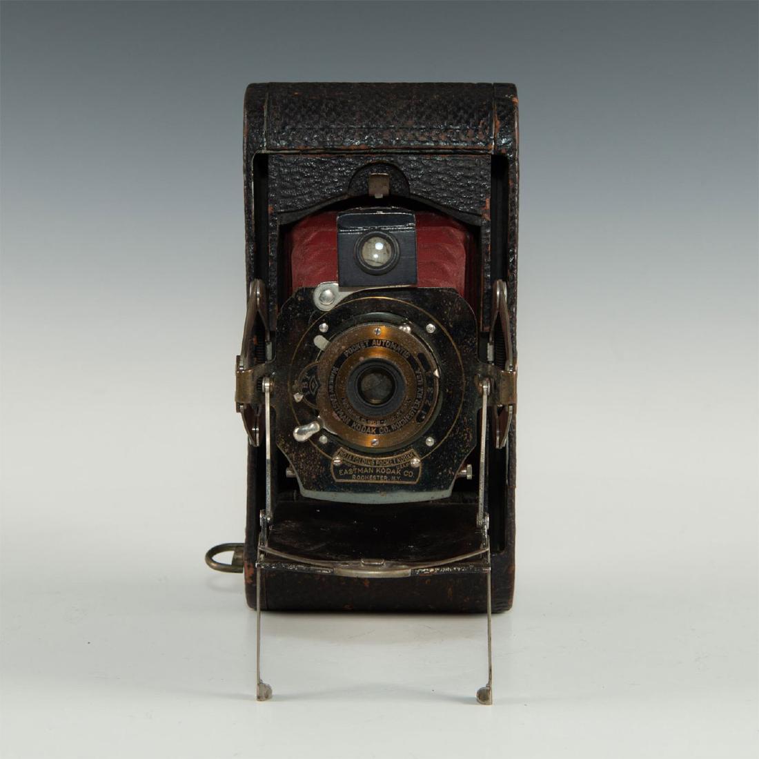 BEAUTIFUL NO.1A FOLDING POCKET KODAK CAMERA: Unique derivative of an early Kodak roll film folding camera. Antique No.1A Folding Pocket Kodak camera. The camera can stand by itself with 2 folding feet. The bellows have a unique color that matche
