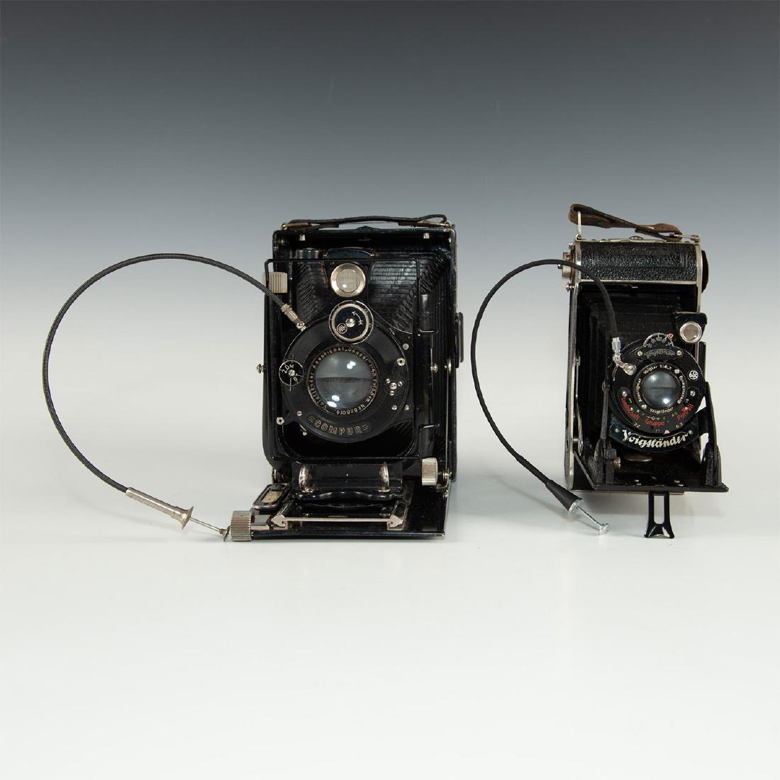 PAIR OF VINTAGE GERMAN VOIGTLANDER FILM CAMERAS: Folding medium format roll film cameras from famed manufacturer. One is Voigtlander Bessa (1929-1956) with Anastigmat Voigtar shutter. One is Avus Voigtlander(1913-1934).Both cameras come with folding