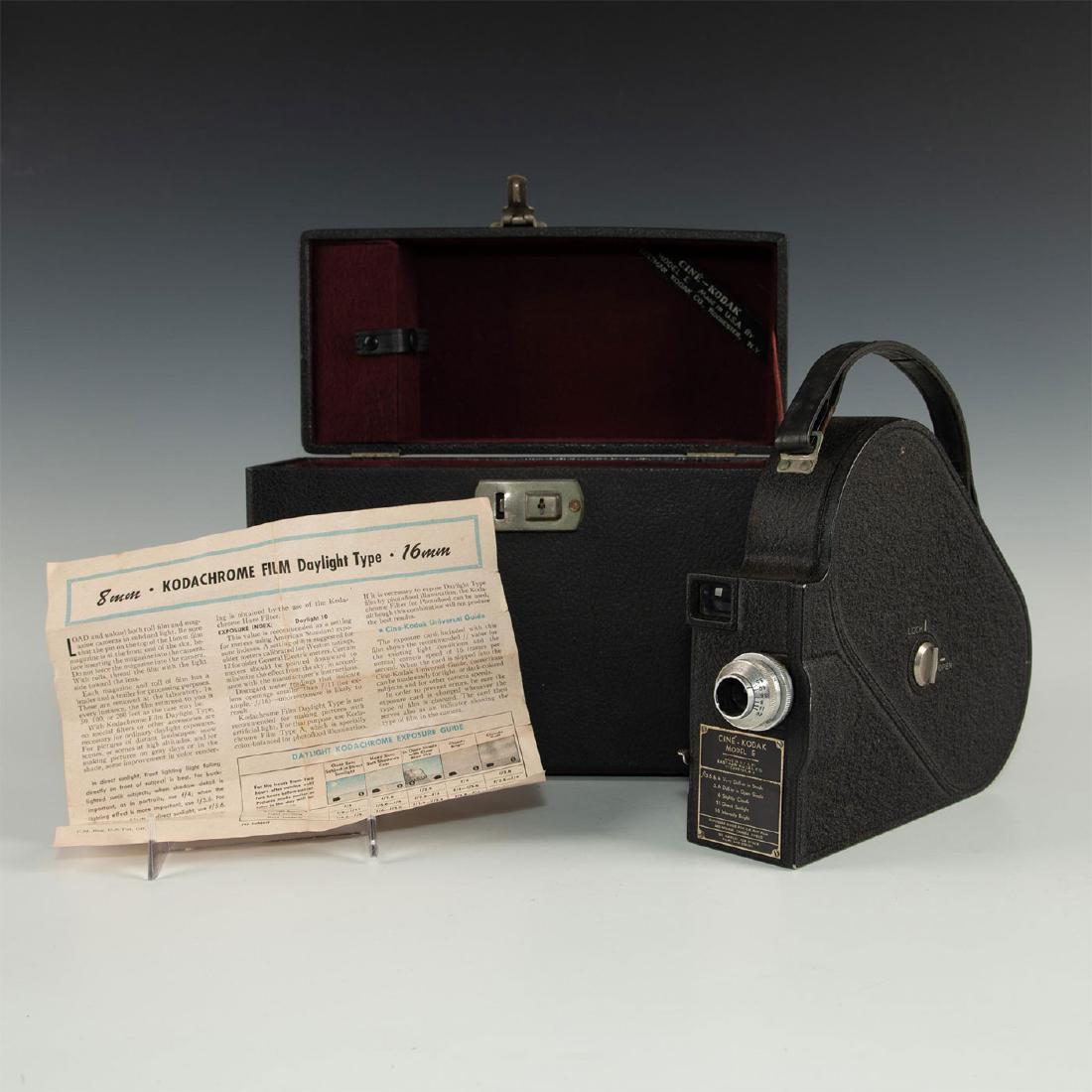 CINE KODAK MODEL E 16MM FILM MOVIE CAMERA WITH CASE: Vintage film camera with classic styling. The Cine-Kodak model E movie camera 16mm was introduced with a shape similar to the later Pathe Webo camera and provided slow motion speeds and an internal vi