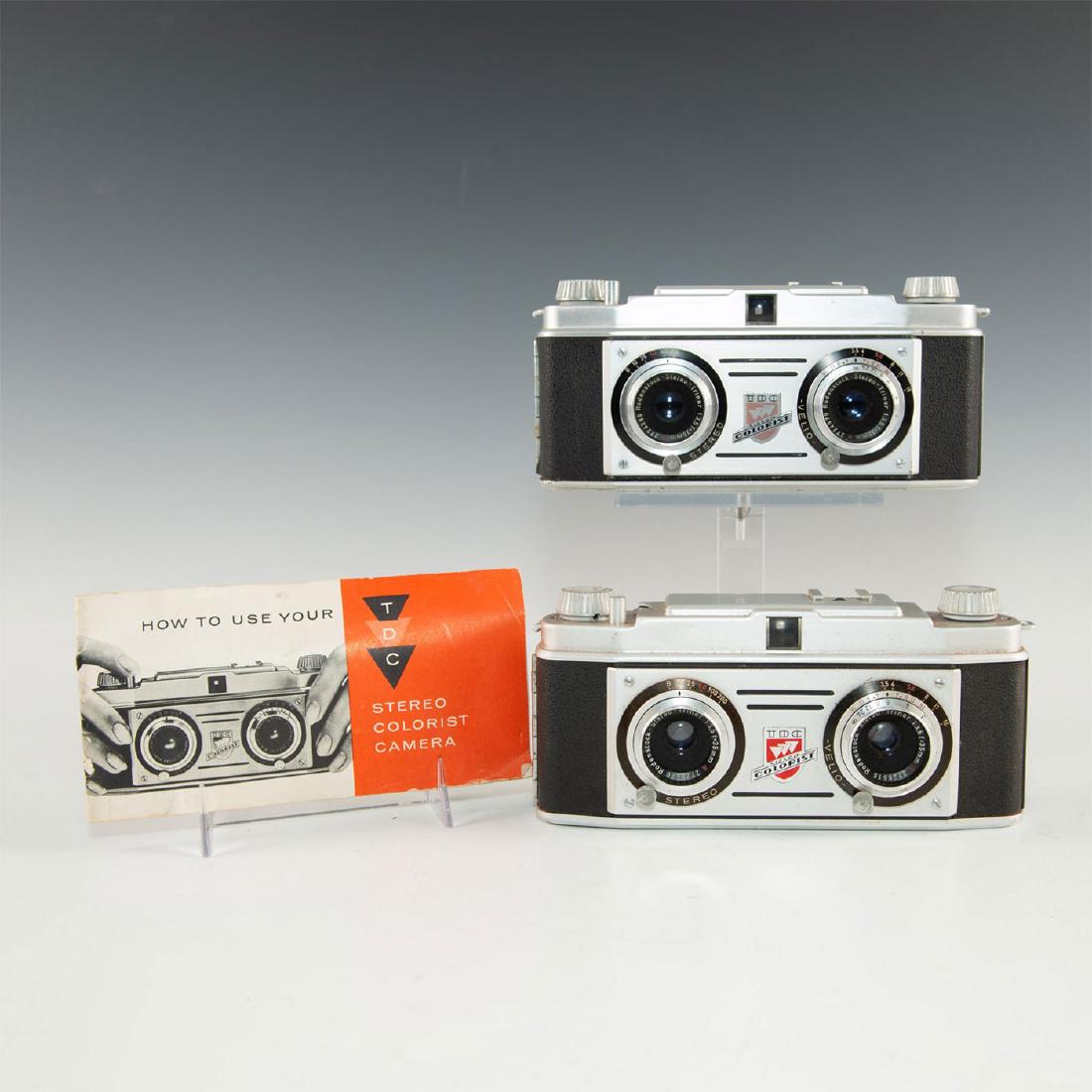 GROUP OF 2 VINTAGE BELL & HOWELL TDC STEREO CAMERAS: Chrome and black leatherette exterior. Introduced in 1954 as a competitor to the popular David White Company Stereo Realist. Made for Three Dimension Company, a subsidiary of Bell & Howell, in Germany