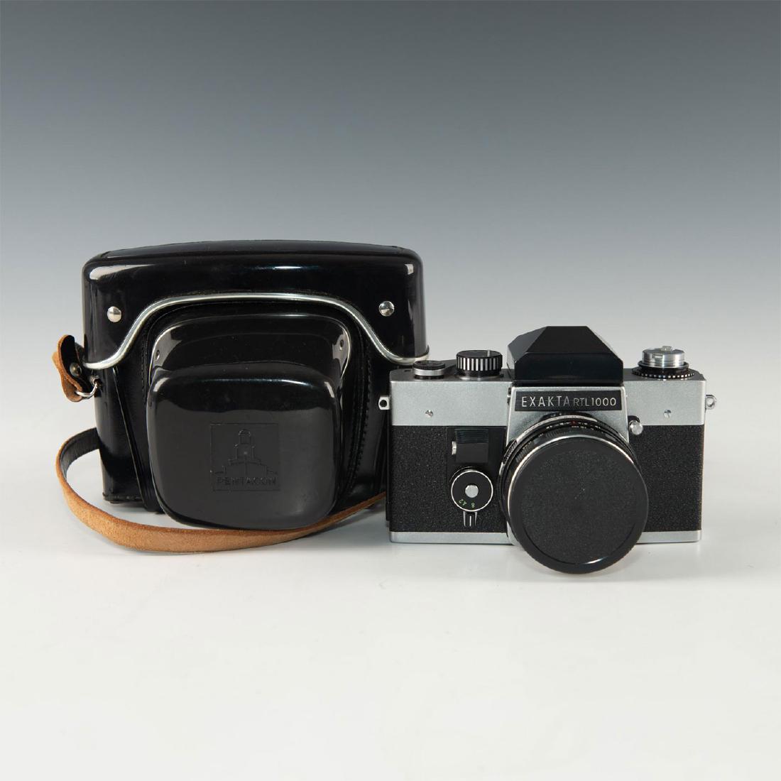 CLOCKWORK VINTAGE EXAKTA RTL1000 SLR IN HARDCASE: Working condition with clean 1.8 F50mm Meyer Gorlitz lens. Solid German SLR camera with working shutter, timer, dual shutter release system, and clean F50mm lens. Shutter speed range 1 second to 1/100