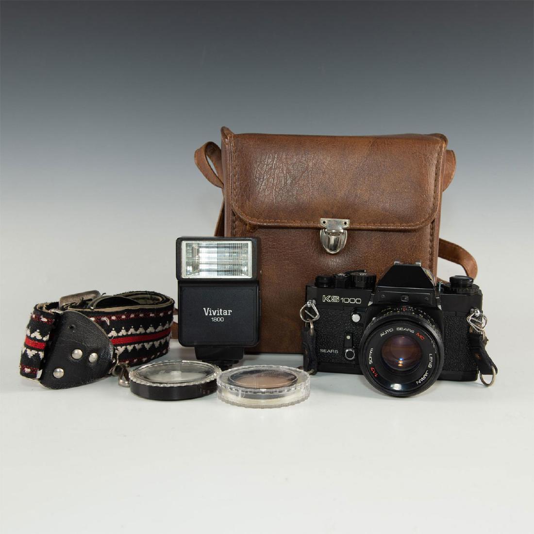 VINTAGE SEARS KS-1000 35MM SLR WITH CASE, FLASH: Black body rebadge by the Sear company. The Sears KS-1000, with metal focal plane shutter and K-mount lenses, was introduced in 1979, and is effectively a Ricoh XR-1 with a rebadge. The black camera c