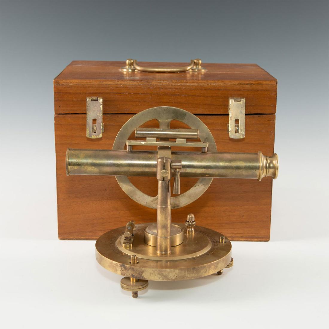 CONTEMPORARY BRASS DISPLAY SURVEYOR'S SCOPE IN BOX: Solid brass construction 2-axis transit with levels, table stand. Great display model of a traditional surveyor's transit scope- a swivel base of solid brass is fitted with adjustable tribrach feet fo