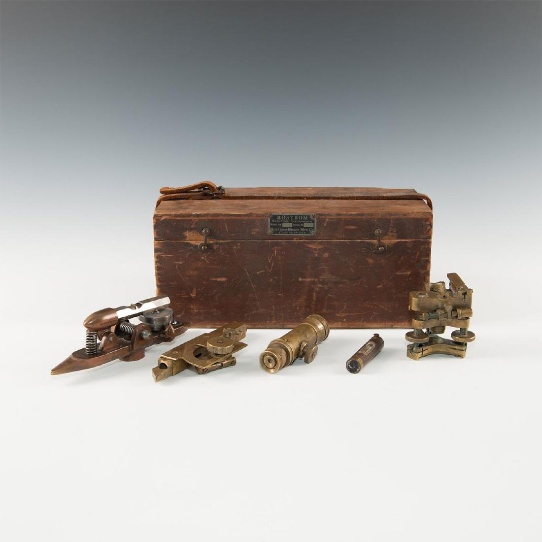 ASSORTMENT OF 5 VINTAGE SURVEY TOOLS IN ANTIQUE BOX: 2 spirit level accessories, adjustable tribrach; 2 scopes; box. Eclectic collection of vintage brass, copper, and chromed instruments and accessories for surveyors, scientific measurements, etc. A sol