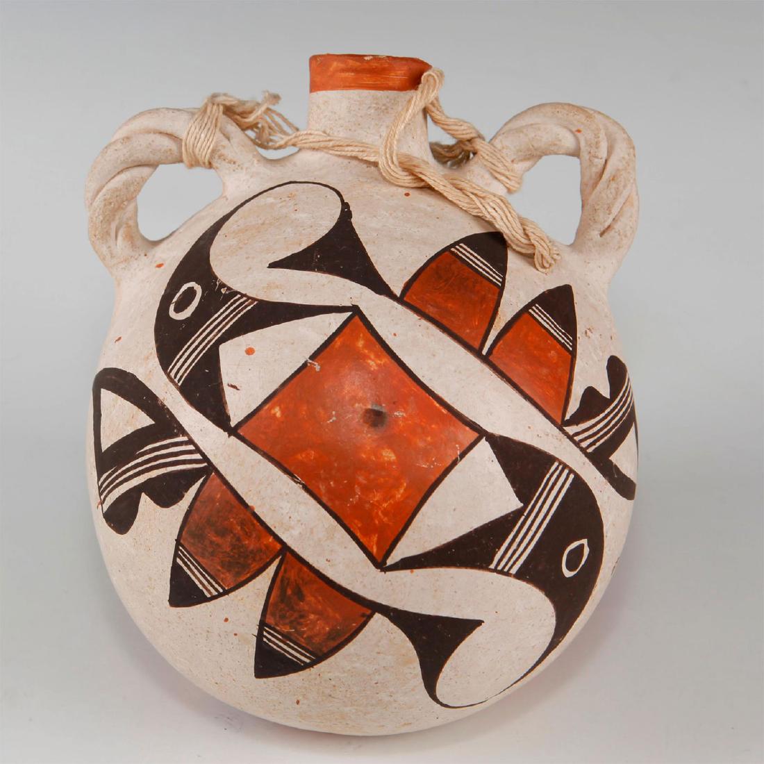 NATIVE AMERICAN ANTIQUE ACOMA CANTEEN: Ceramic vessel attributed to Pueblo make. A white slip vessel with rag-washed ocher bottom and polychrome decoration as favored by the Acoma Pueblo tribe. Twisted loop handles for use as a hanging wat