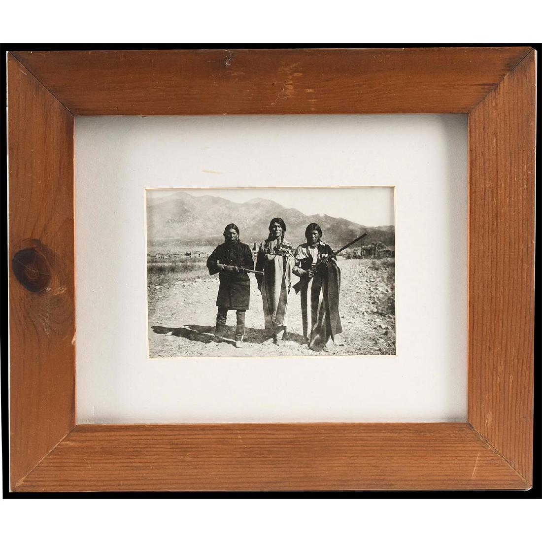 NATIVE AMERICAN FRAMED PHOTOGRAPH, B.G. RANDALL: Picture Title: A Winchester and a Remington Falling Block. Taken from an original 1905 photograph of three Native Americans, by 19th-20th century New Mexico photographic journalist B. G. (Benjamin Gur