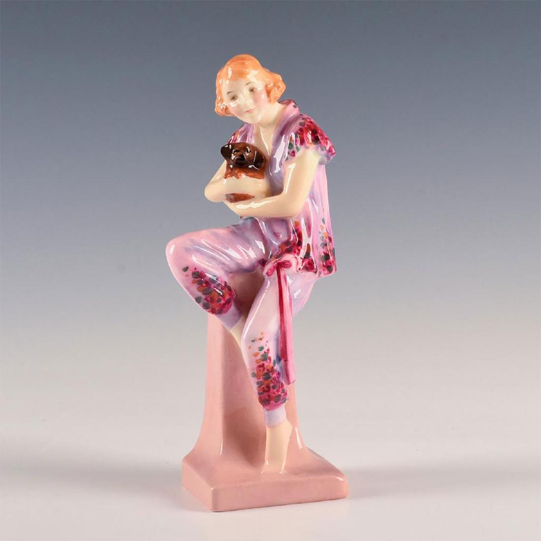 ROYAL DOULTON FIGURINE, LIDO LADY HN1220: First version, lustre of pink, red, and other colors. Modeled as a young woman wearing a beach top and bottoms, seated with her dog. A rare Art Deco figurine, the name for which may have been taken