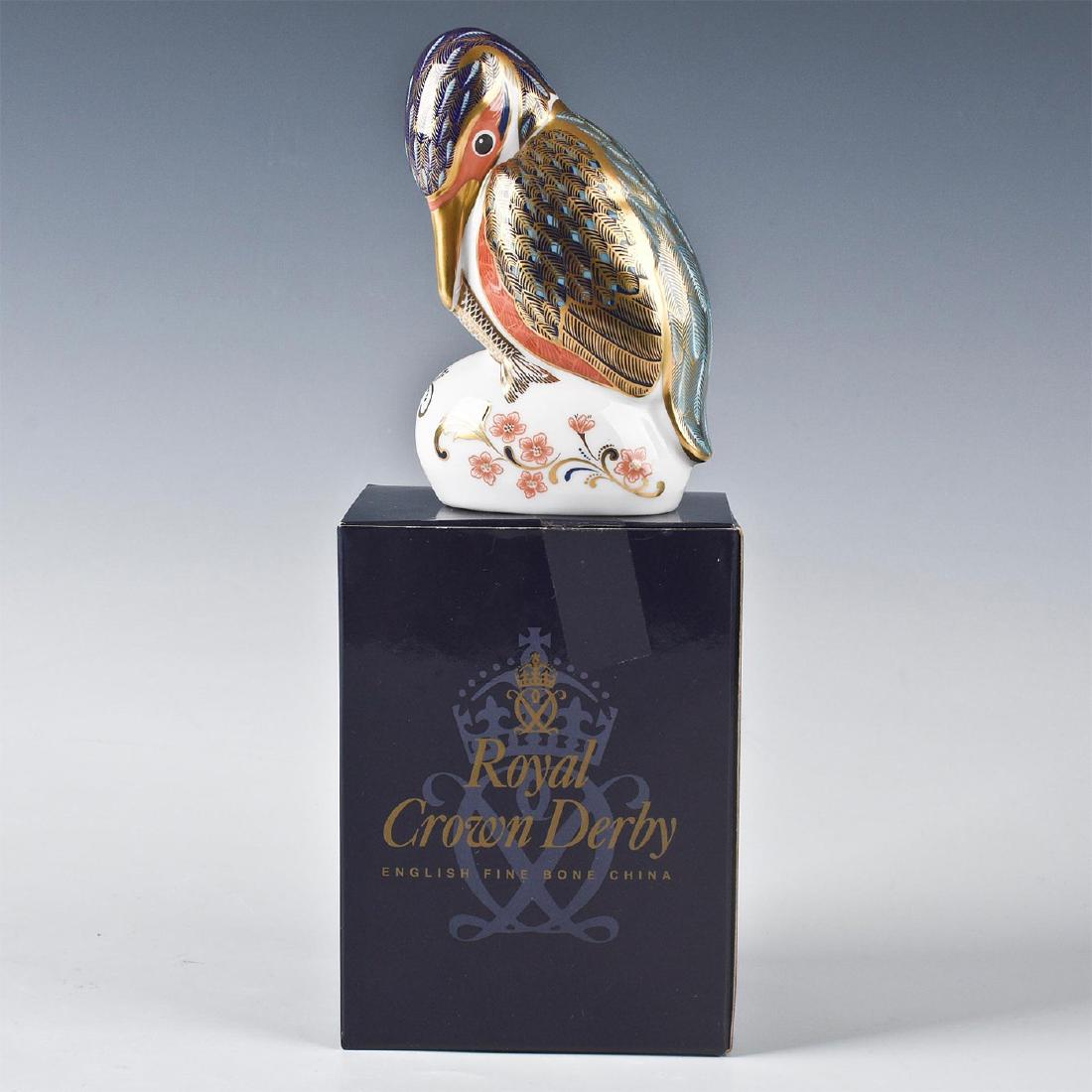 ROYAL CROWN DERBY KINGFISHER BIRD FIGURINE: Paperweight of fine bone china with 22k gilding. Royal Crown Derby backstamp on bottom, with gold color stopper. Includes original box. Issued: 2000s Dimensions: 4.5"H Manufacturer: Royal Crown Derby 
