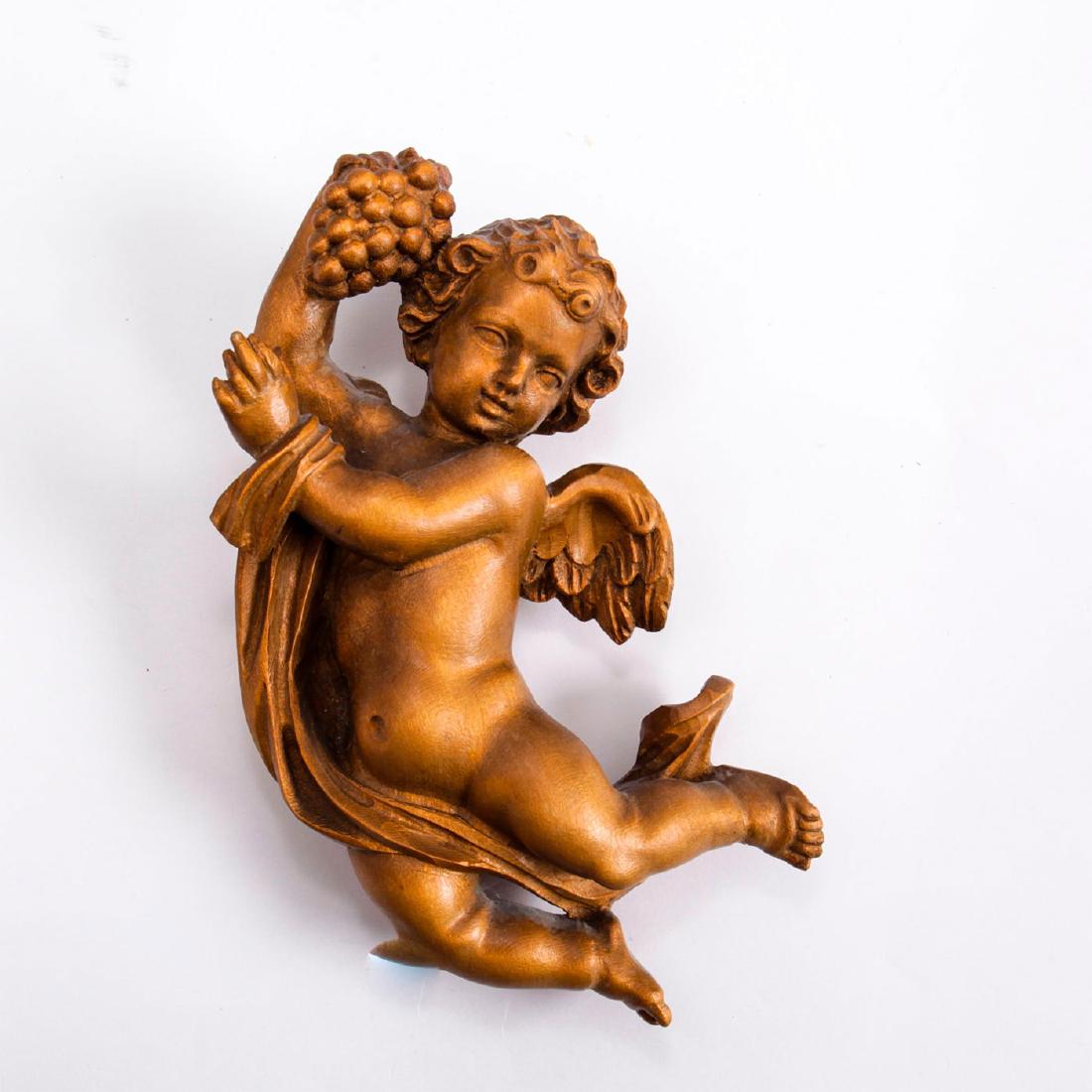 ART NOUVEAU WOODEN CHERUB ANGEL WITH GRAPES: Italian German. Allegorical. Hand carved, bronze patina. Issued: 20th c. Dimensions: 8"H Country of Origin: South Tyrol