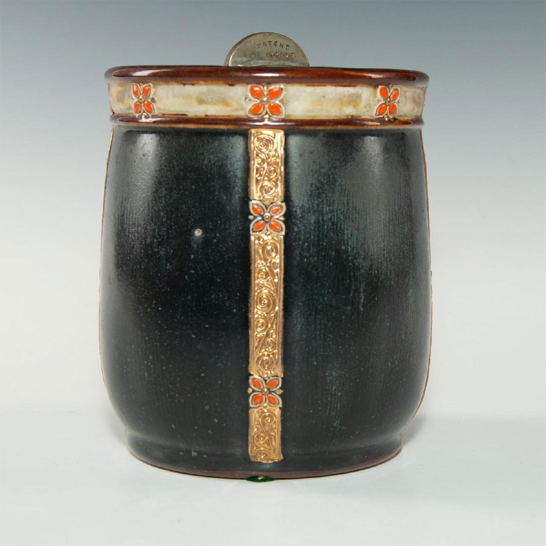 ROYAL DOULTON TOBACCO JAR FOR ALFRED DUNHILL: Art Nouveau glazed stoneware with floral decoration, metal lock. Produced for Alfred Dunhill, with floral and gilt decoration. Incised to top metal lock device ALFRED DUNHILL NEW YORK. Stamped to base