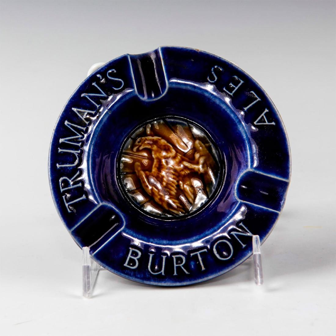 DOULTON LAMBETH ADVERTISING WARE ASHTRAY: Decorative glazed tobacciana in cobalt blue and brown. Stamped to base ROYAL DOULTON LAMBETH ENGLAND with impressed potters marks. Issued: c. 1927 Dimensions: 1"H x 4.75"D Manufacturer: Royal Doulton 