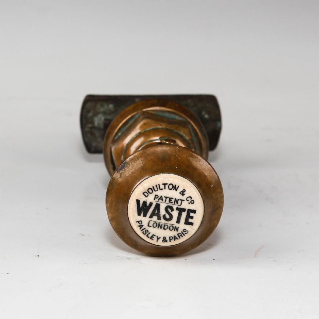 DOULTON & CO. BRASS PLUMBING TAP, WASTE PULL: Marked DOULTON & CO. PATENT WASTE LONDON PAISLEY & PARIS. Issued: Early 20th c. Dimensions: 6.75"H Manufacturer: Doulton & Co. Provenance: Melinda Alexander-Sejas Country of Origin: England