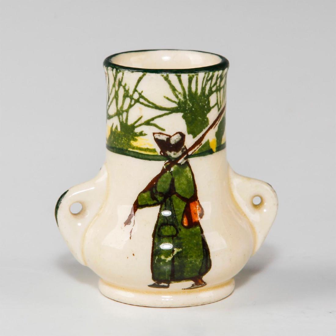 ROYAL DOULTON MINI VASE, ISAAC WALTON GALLANT FISHERS: Early 20th c. fishing themed miniature vase. Marked 7024. Depicts fisherman inspired by THE COMPLEAT ANGLER by Isaac (Izaak) Walton, first published in 1653. This miniature double handled vase feature