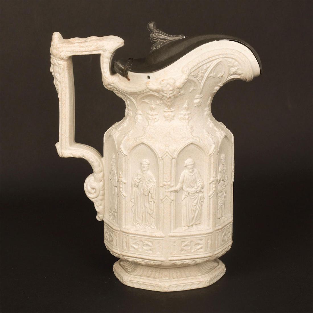 STAFFORDSHIRE SALTGLAZE NEO GOTHIC REVIVAL APOSTLE JUG: Gothic Revival style raised figures in niches, marked pewter lid. An iconic mid-10th century saltglaze jug depicting eight saints, modeled by Hanley, Staffordshire pottery of Charles Meigh. Impressed 