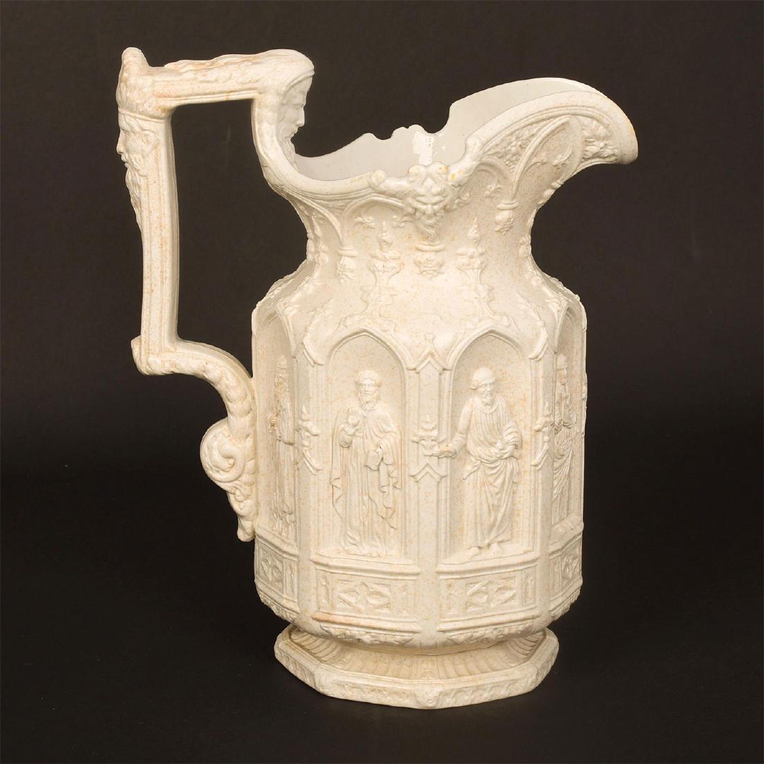 STAFFORDSHIRE SALTGLAZE NEO GOTHIC REVIVAL APOSTLE JUG: Gothic Revival style raised figures in architectural niches. An iconic mid-10th century saltglaze jug depicting eight saints, modeled by Hanley, Staffordshire pottery of Charles Meigh. Impressed marks