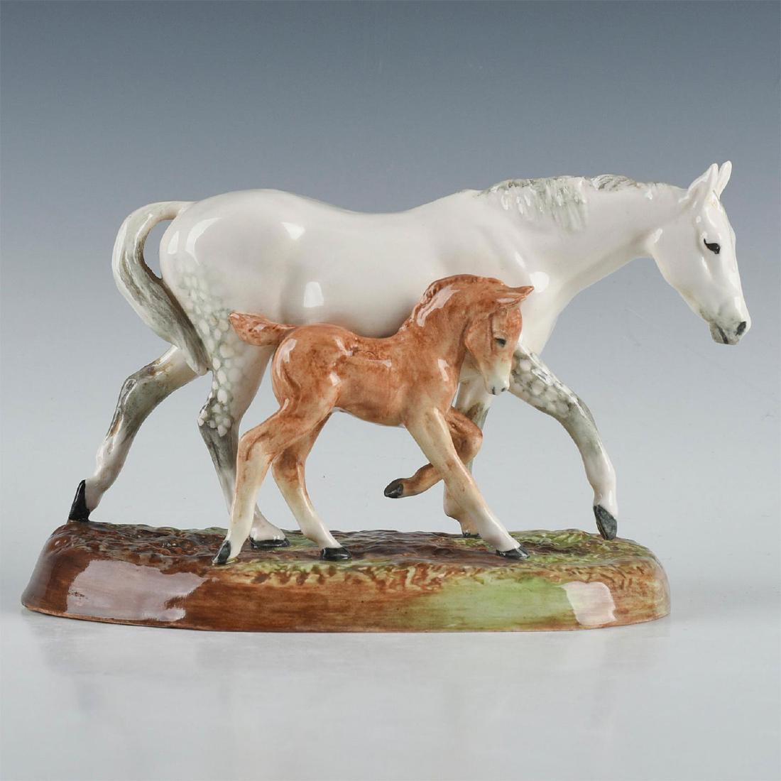 ROYAL DOULTON ANIMAL FIGURE, GUDE GREY MARE AND FOAL: HN2532, grey, white and brown colorway. Royal Doulton backstamp. Minor chip to glaze of base. Artist: W.M. Chance Issued: 1940-1967 Dimensions: 5"H x 7.5"L Manufacturer: Royal Doulton Country of Origi