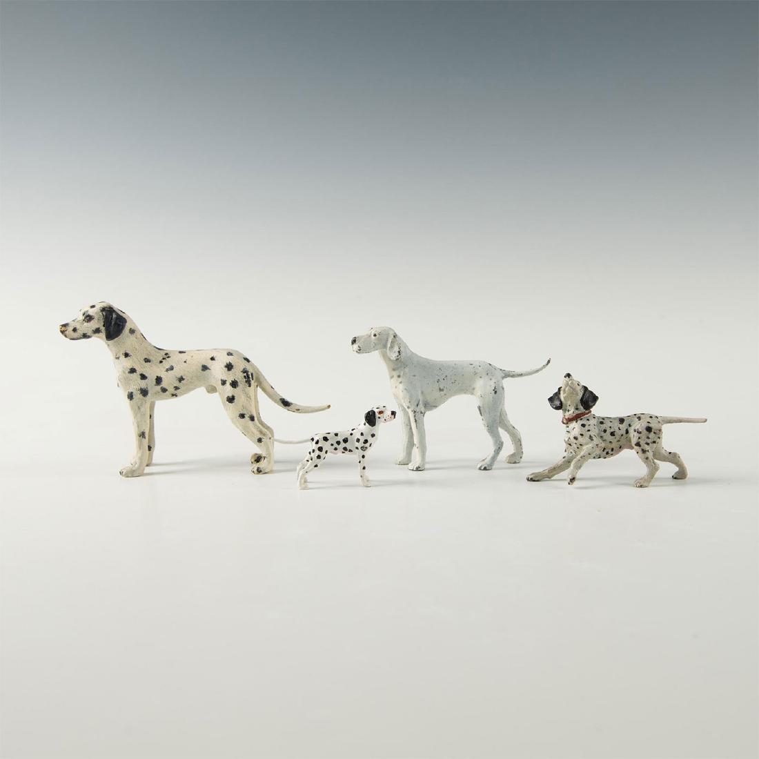LOT OF 4 CAST BRONZE, IRON DALMATION ANIMAL FIGURINES: Three bronze and one cast iron painted hounds. Dimensions: 3"H, 2.5"H, 1.75"H, 1.25"H