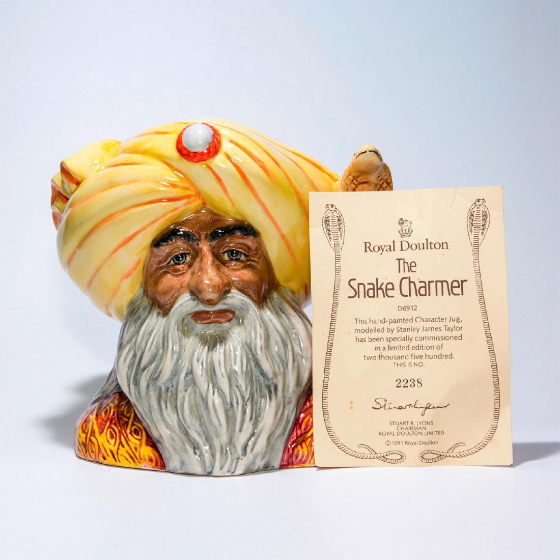 ROYAL DOULTON CHARACTER JUG, SNAKE CHARMER D6912: Snake Charmer D6912 Large. Signed and numbered on bottom. CoA included. 2238 of 2500. Artist: Stanley James Taylor Issued: 1992 Dimensions: 7"H Edition Number: 2238 Edition Size: 2500 Manufacturer: Ro