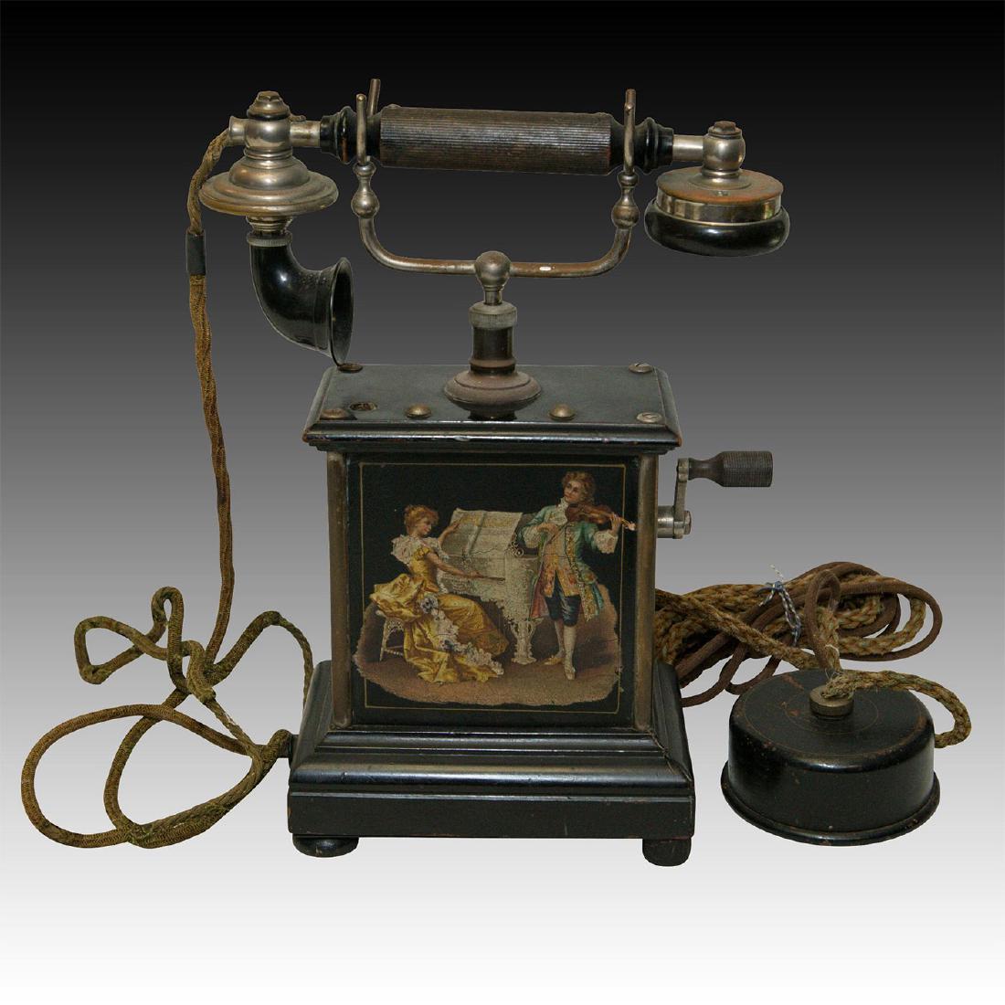 K.T.A.S. DANISH CRANK TELEPHONE: Black metal carriage. Side crank. Bakelite Grabaphone handset. Issued: c. 1895 Dimensions: 11"H Country of Origin: Denmark
