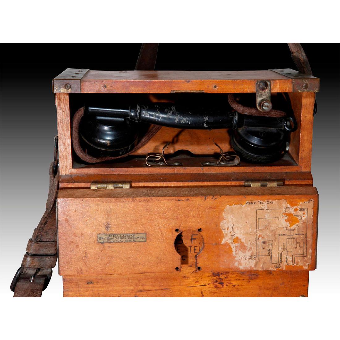 KELLOGG U.S.FOREST SERVICE WOODEN PORTABLE TELEPHONE: Field phone. Original leather strap, decals and heavy wood box. Issued: 1933 Country of Origin: United States