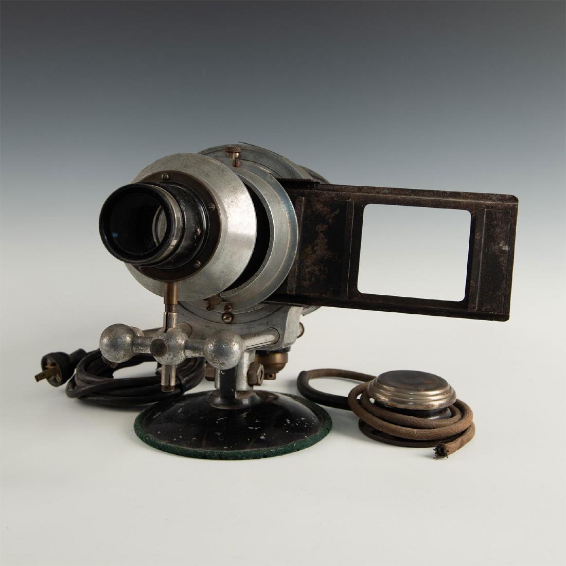 VICTOR MAGIC LANTERN SLIDE PROJECTOR: Early Victor Animatograph Stereopticon projector and slides. Designed to project images from glass plate slides, with different lenses available to reproduce clear images of varying sizes. Produced in