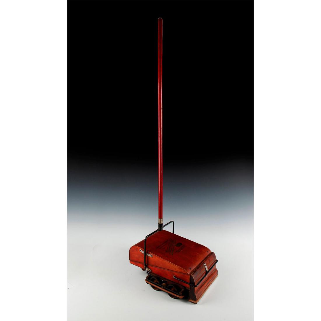 ANTIQUE CARPET SWEEPER VACUUM CLEANER: Early 20th century wheeled bellows combination sweeper vacuum. Produced by the Wright Family and Pneuvac Company of Boston, MA. Wooden cabinet with metal brackets and other features. Gold embossed SWE