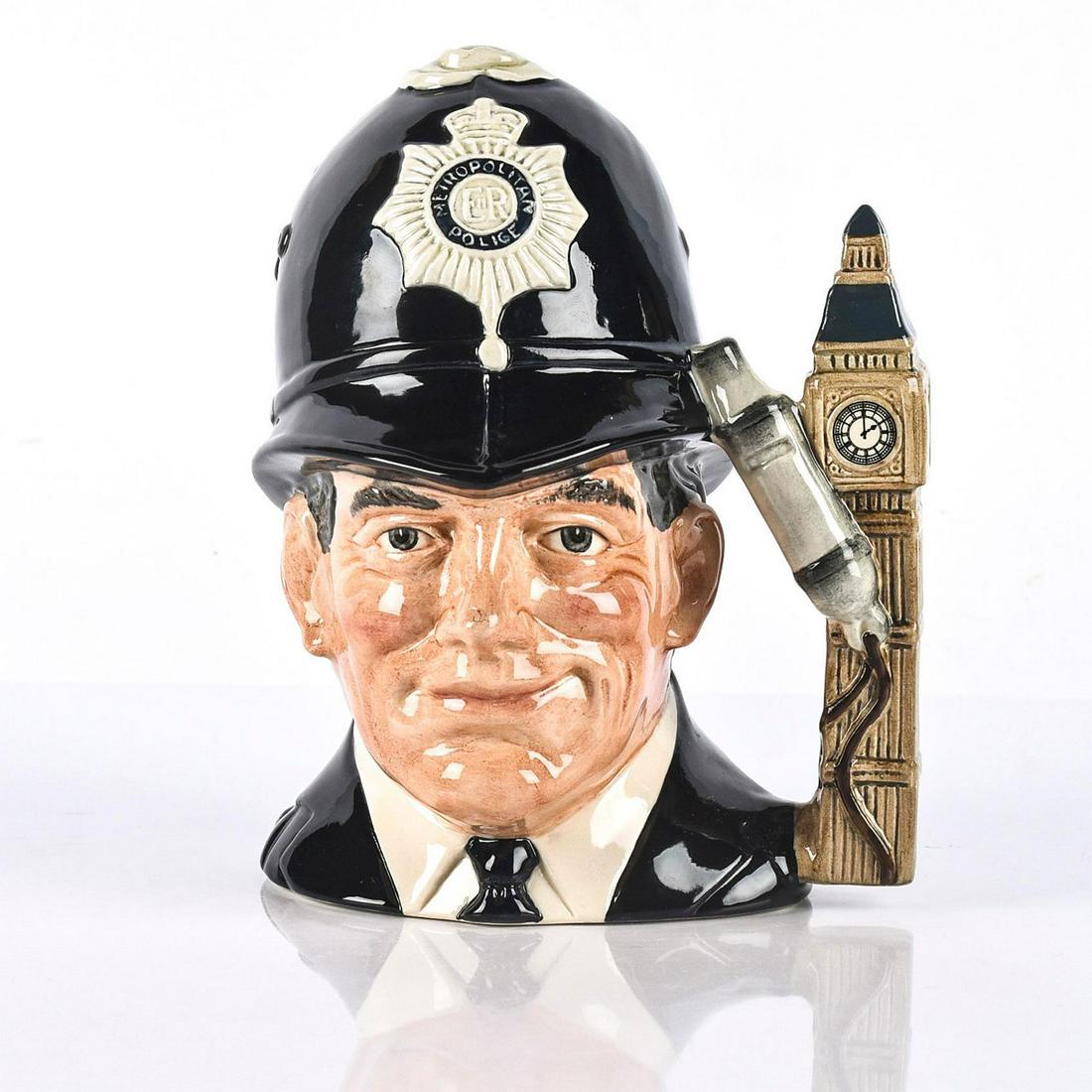 ROYAL DOULTON CHARACTER JUG THE LONDON BOBBY D6744: Hat badge embossed. Stamped to base ROYAL DOULTON ENGLAND and other marks. Artist: Stanley J. Taylor Issued: 1985 Dimensions: 7.25"H x 6"W Manufacturer: Royal Doulton Country of Origin: England