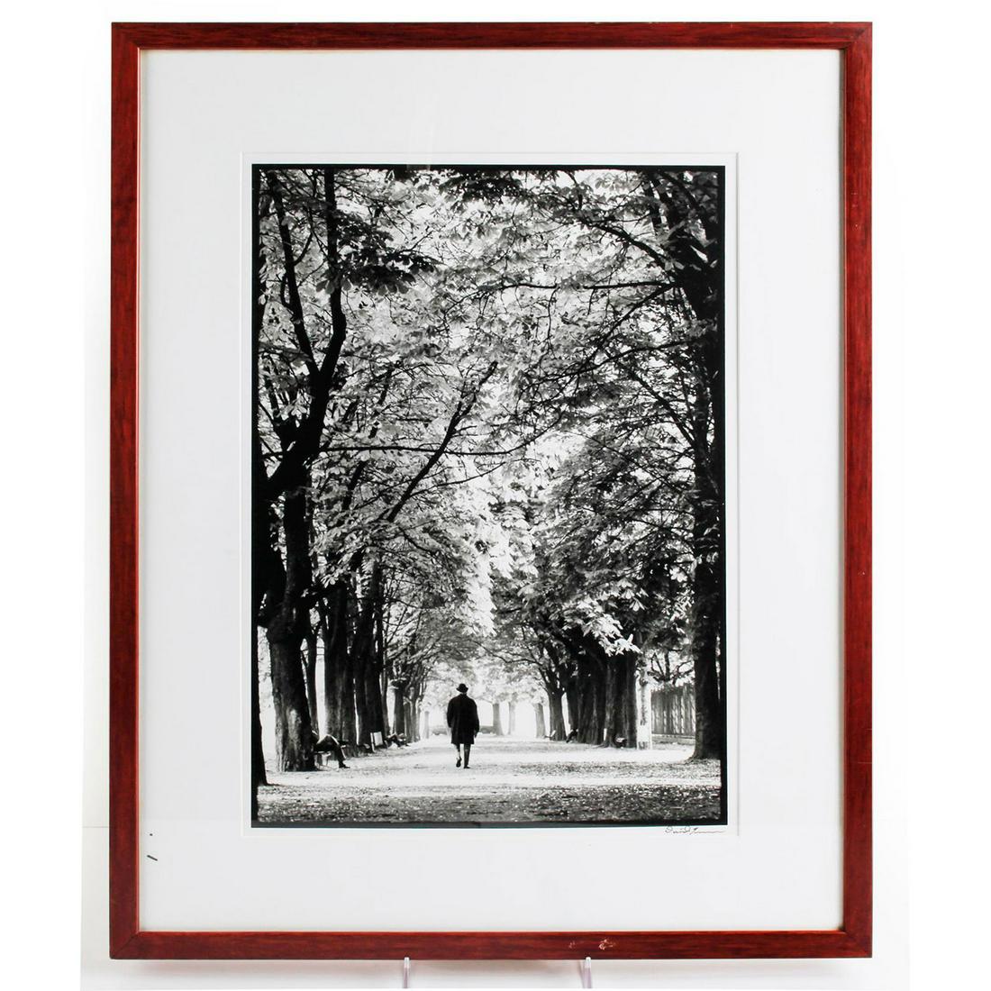 DAVID TURNER PHOTOGRAPH, PATHWAY IN PARK: Black and white photograph of man walking through trees in park. Signed by artist, lower right. 18.75"H x 12.75"W, pictured. Artist: David Turner Issued: Late 20th-Early 21st c. Dimensions: 26.5"H x 2