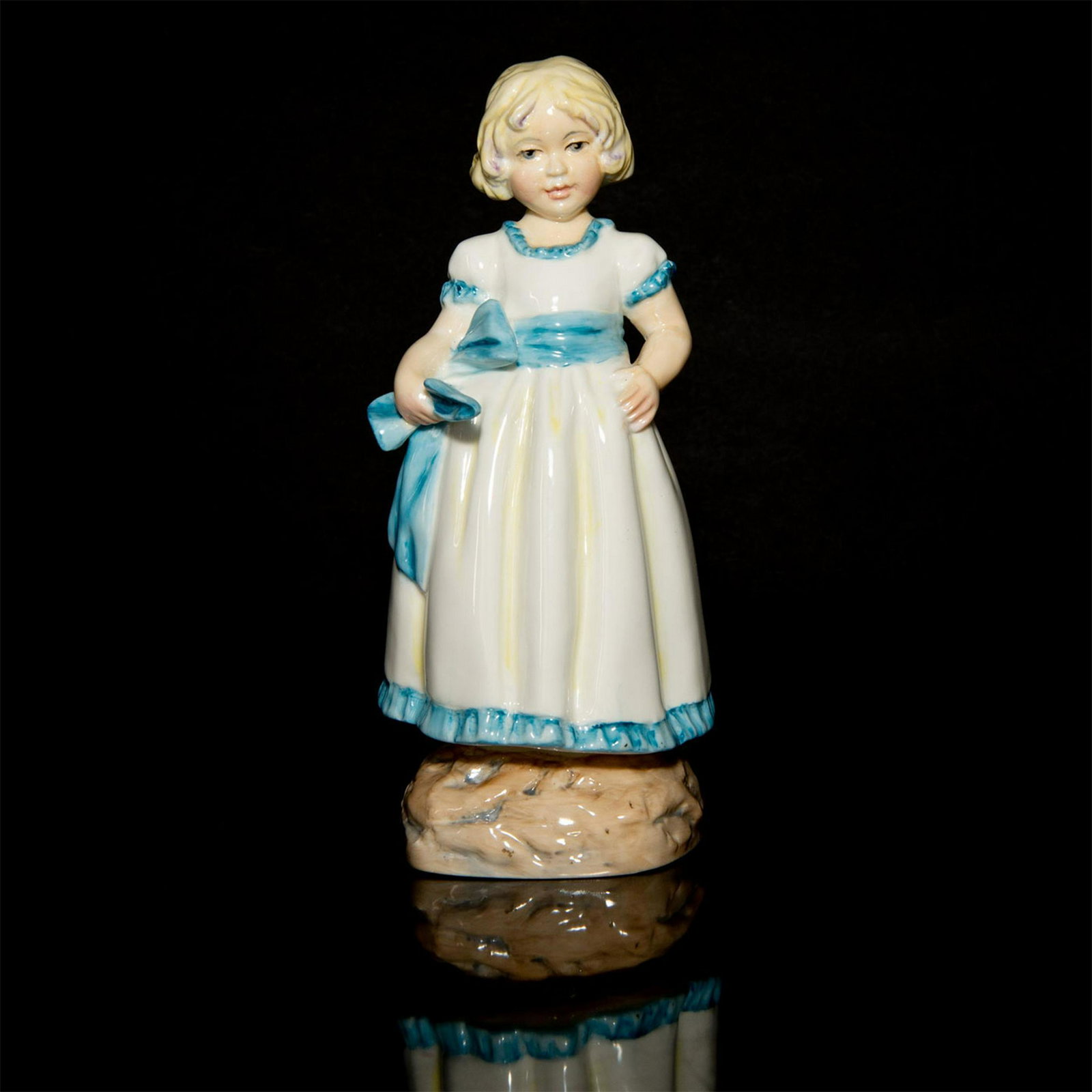 ROYAL WORCESTER FIGURINE, MONDAY'S CHILD - GIRL 3519: Handpainted, part of the Days of the Week series. Bottom base marked MONDAY'S CHILD IS FAIR OF FACE. Royal Worcester backstamp. Issued: 20th c. Dimensions: 6.5"H Manufacturer: Royal Worcester Country 